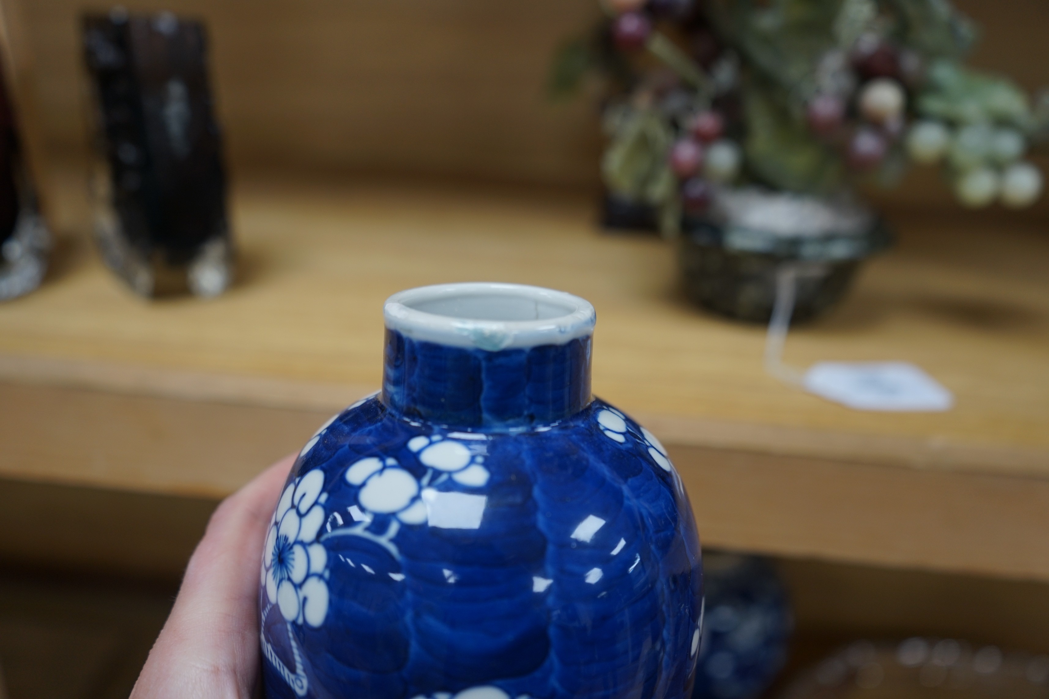 A group of Chinese blue and white prunus vases and jars and covers and jars, pair of vases 23 cms high